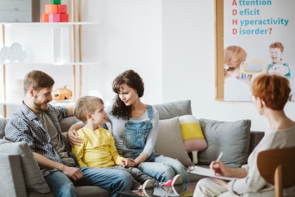 Family with child speaking with an assessor β ADHD and autism evaluations at Minnesota Mental Health Clinics