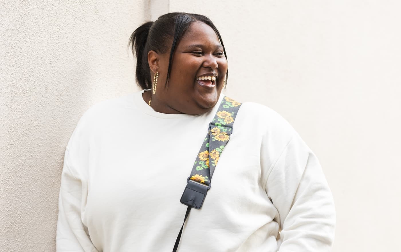 Young woman smiling confidently outdoors β the clarity and wellbeing that psychiatric care at MMHC can help you find