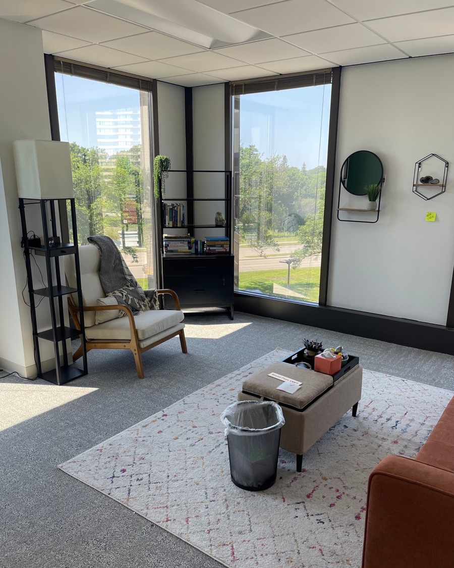 Bright and welcoming therapy office at Minnesota Mental Health Clinics with large windows, a single armchair, and an open layout.